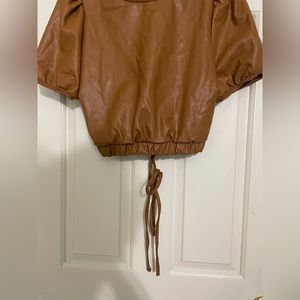 Brown laced back crop top.